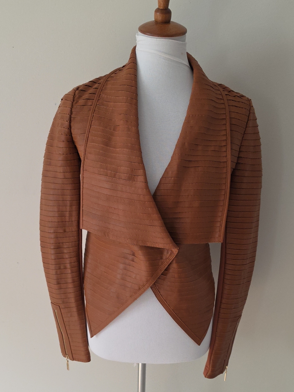 Marciano Los Angeles Asymmetrical jacket with a one-button closure.